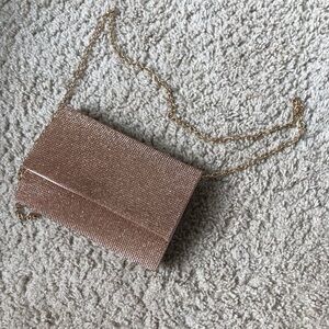 Gold gemmed shoulder/crossbody purse with gold chain and rose gold inside